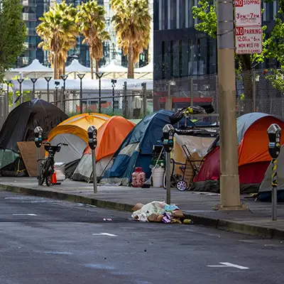 People sleeping in places not meant for living—such as cars, tents, parks, or abandoned buildings.